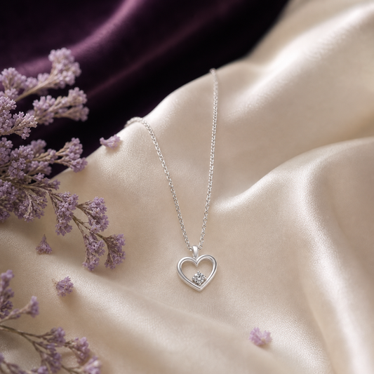 Heart silver pendant necklace on ivory silk